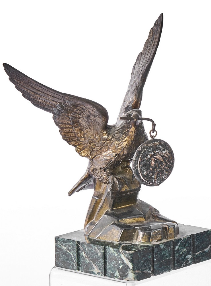 PORTE-MONTRE en régule doré figurant un aigle...