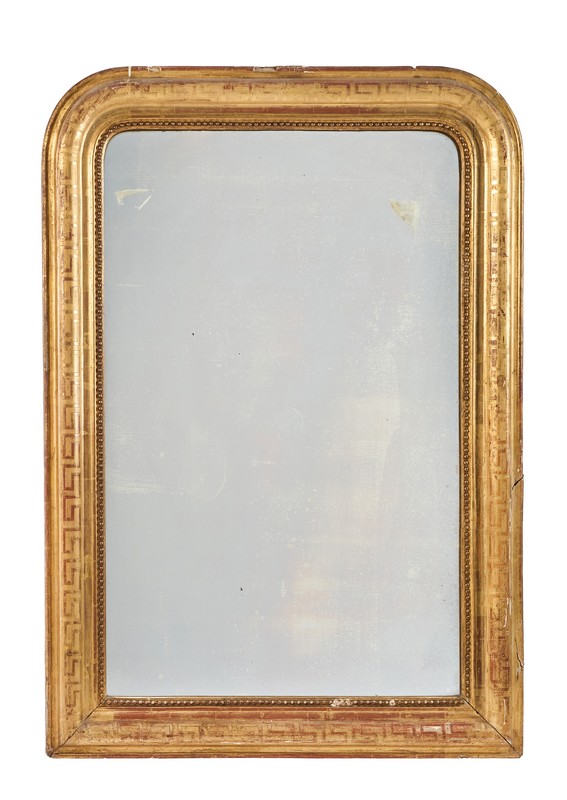 MIROIR en bois doré et sculpté à frises de...